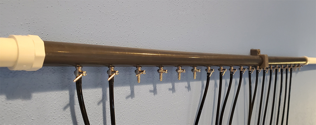 Air distribution manifold connected in the closed loop central air system. Pre-built one can see it mounted and delivering air to individual airline tubing drops.